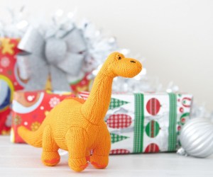 knitted orange diplodocus rattle baby dinosaur toy